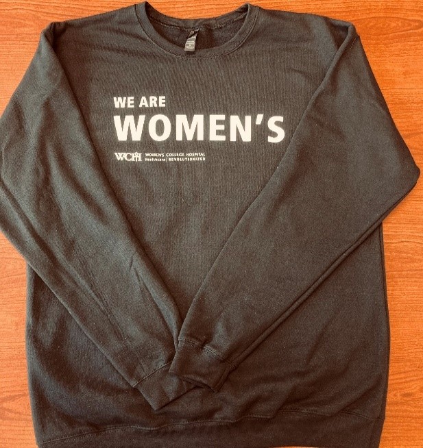 A sweatshirt with the woreds "we are women's" on it