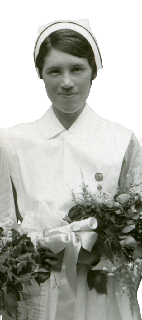 Beatrice Quachigan in 1933 holding flowers and wearing a nursing uniform from the time.