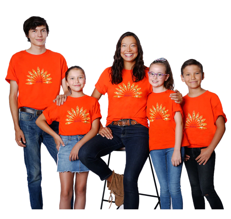 A Family wearing orange shirts